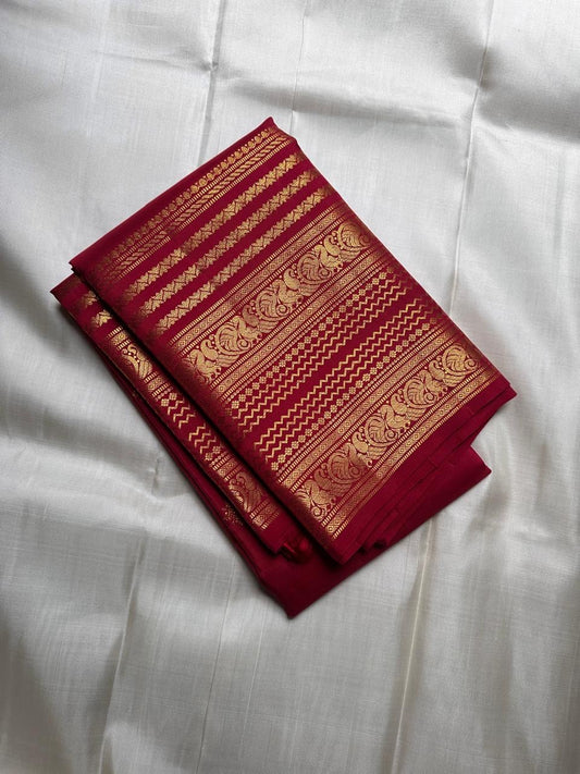 Pure Kanchipuram silk saree in raspberry pinkish red with traditional varisaipet gold zari border and classic butta motifs