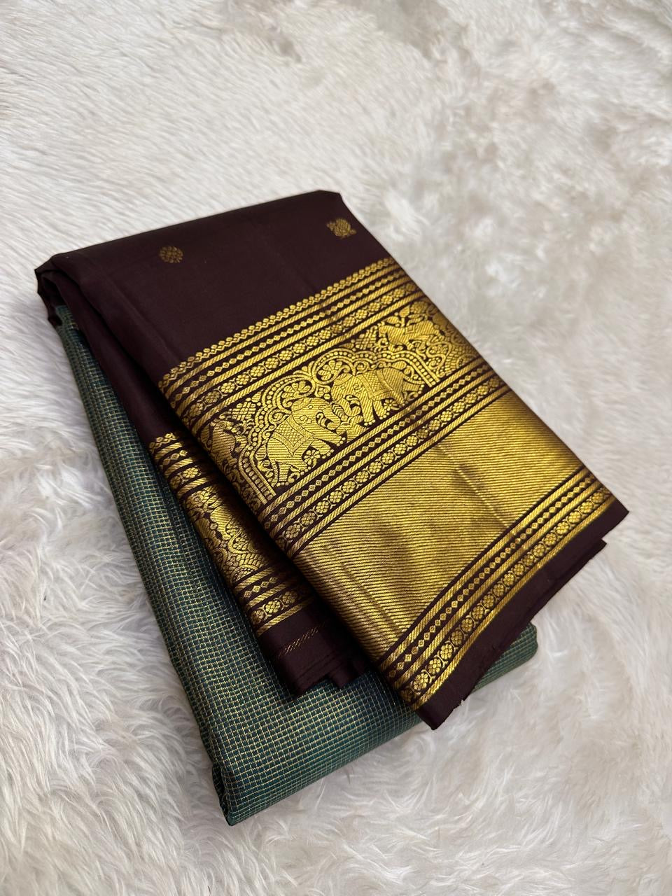Pine green Kanchipuram silk saree with zari kattam checks and deep brown zari border folded view
