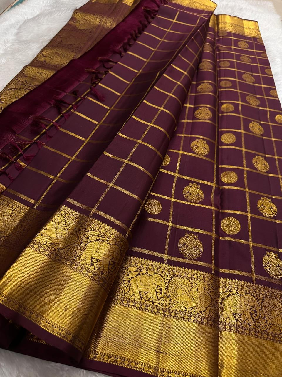 Kanjeevaram silk saree gold zari border on plum silk base