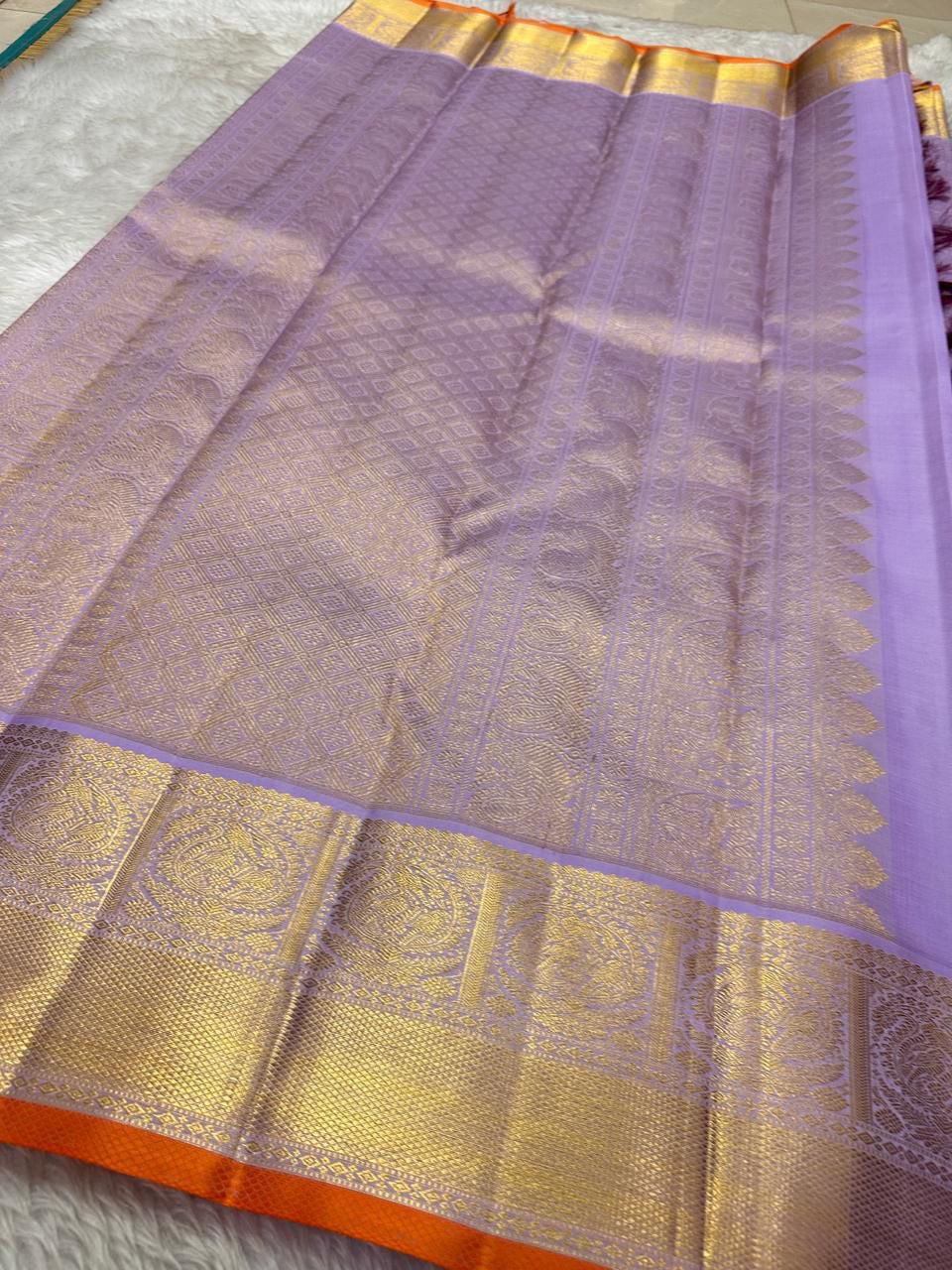 Gold zari pallu and border detail on lavender pure Kanchipuram silk saree, shipped from New Jersey USA.
