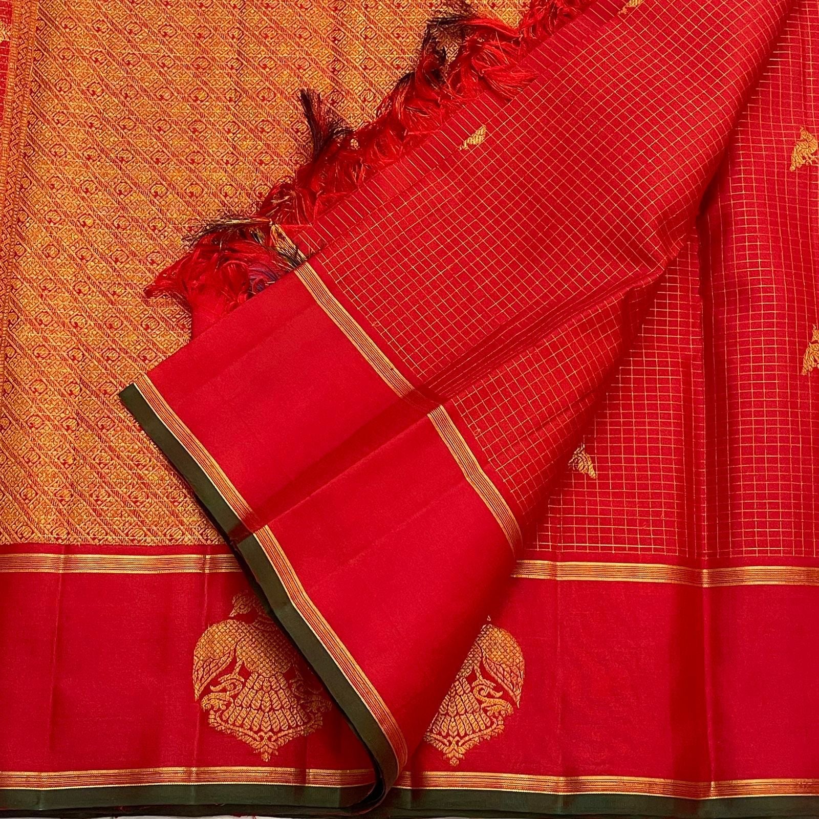 Full view red checked pure Kanchipuram silk saree with small gold zari buttas, gold zari border, and Gandaberunda motifs