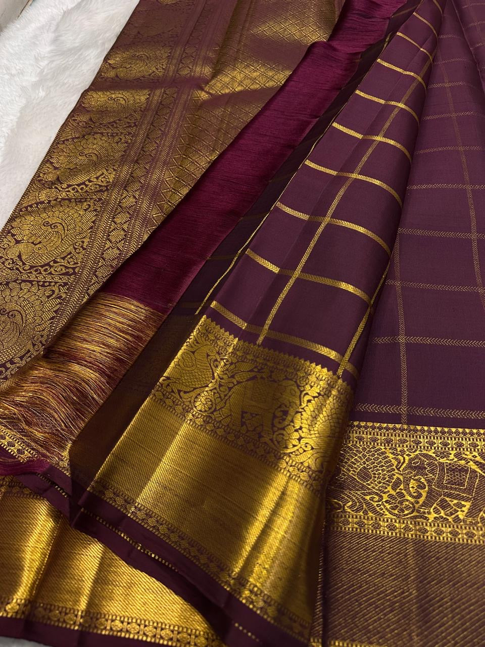 Kanchipuram silk saree zari kattam grid pattern plum closeup