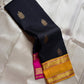 Navy blue pure Kanchipuram silk saree with antique gold zari buttas and Ganga Jamuna mustard and pink border