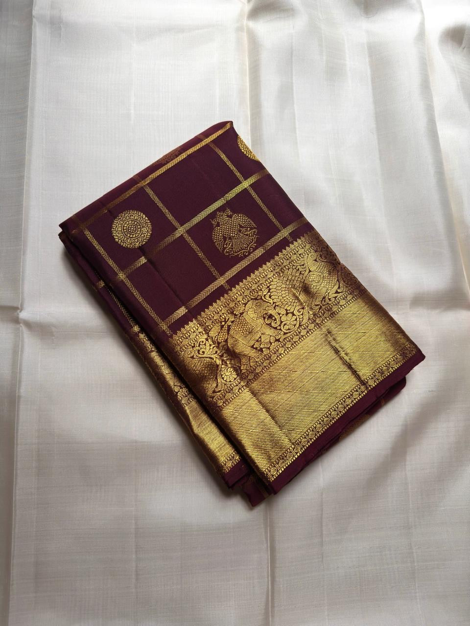 Wine plum Kanjivaram silk saree with zari kattam checks folded view