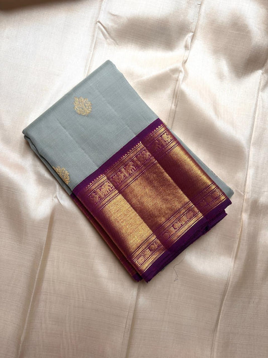 Folded dovetail grey Pure Kanchipuram Silk Saree with purple zari border and gold motif, available in the USA