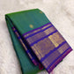 Green Kanjivaram silk saree with sorgavaasal mayil motifs and zari kattam border draped view