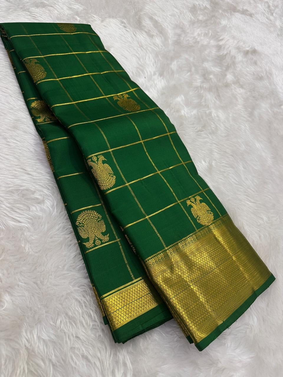 traditional tested zari detail on emerald green Kanchipuram silk saree