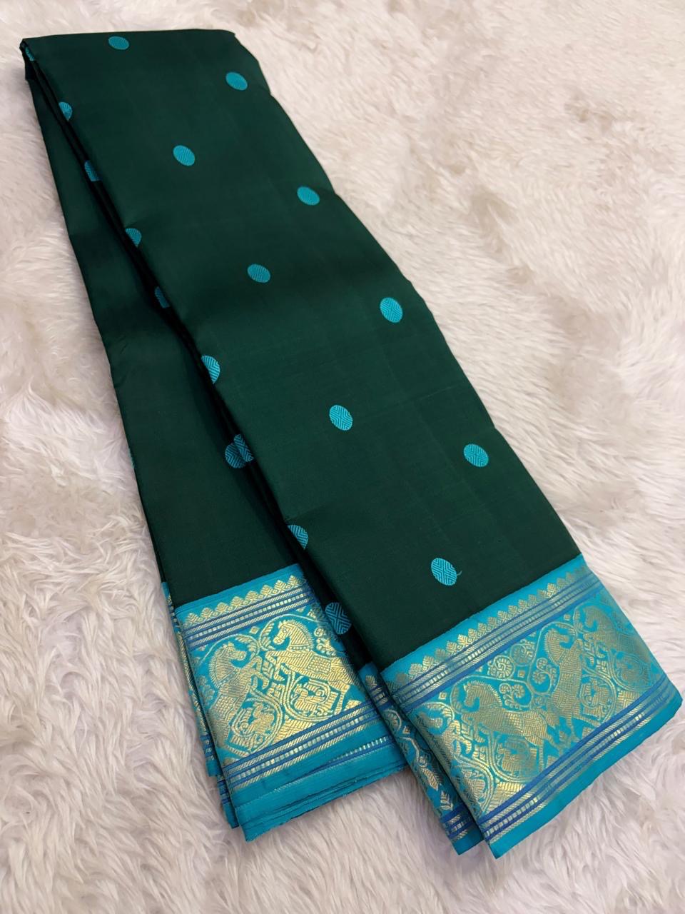traditional tested zari detail on deep green Kanchipuram silk saree
