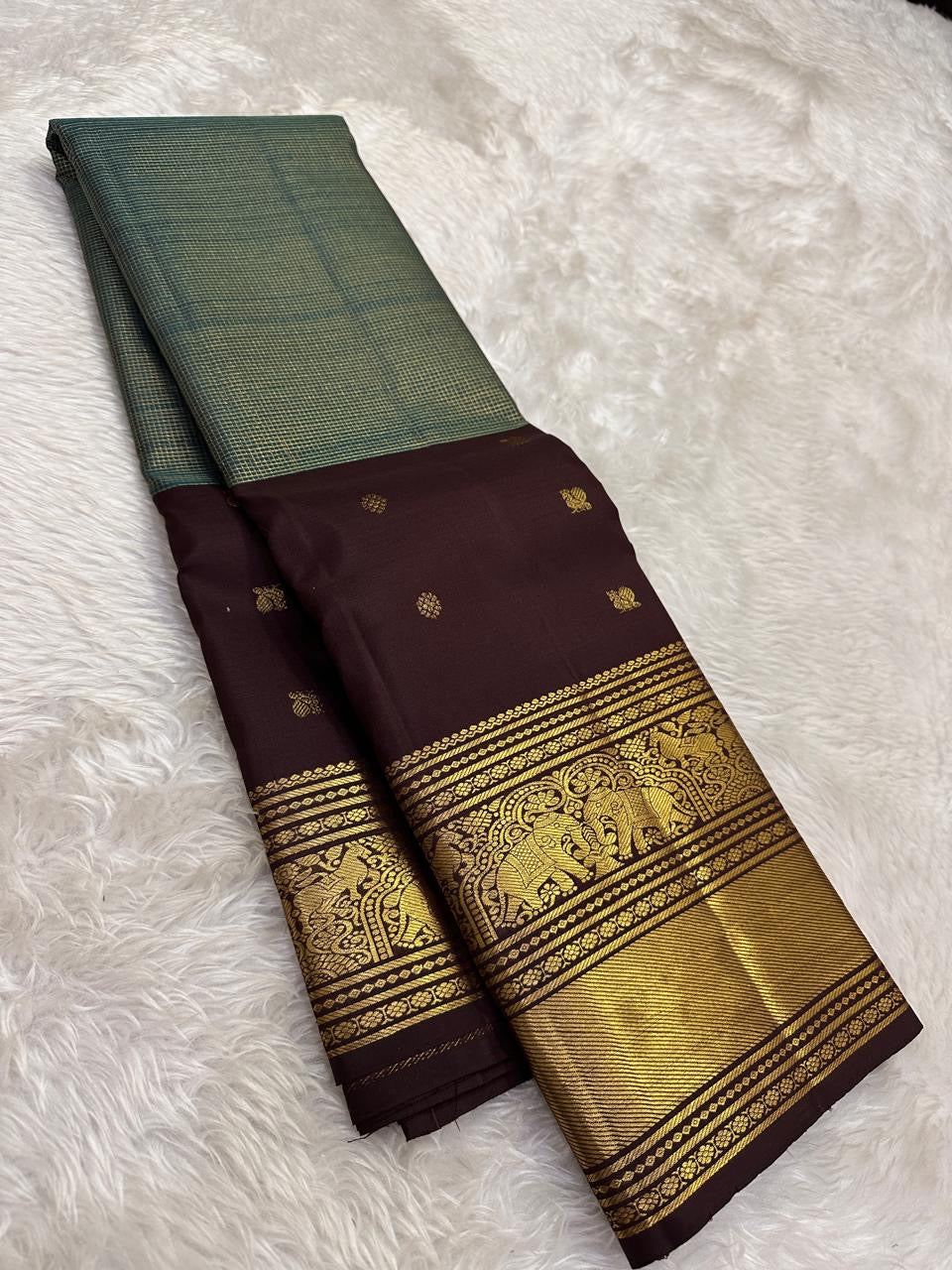 Kanjivaram silk saree green check pattern with traditional gold zari detail
