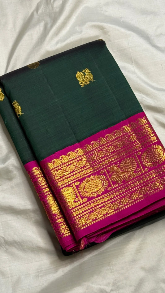 Lush green Kanjivaram silk saree with magenta korvai border folded view