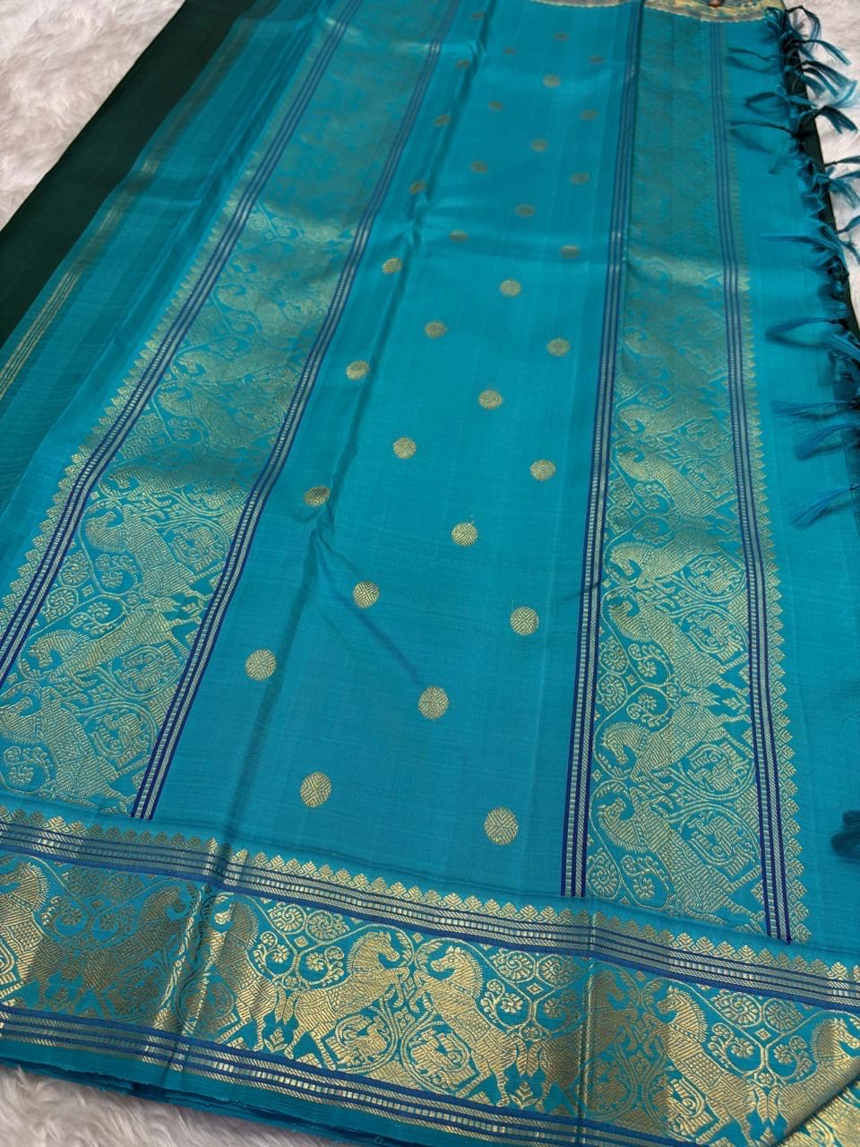 pb pallu detail of deep green Kanchipuram silk saree