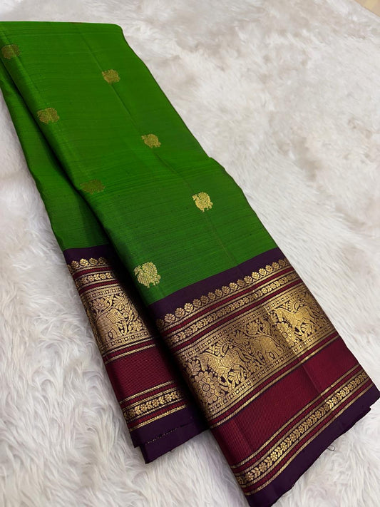 grass green kanchipuram silk saree with pavun butta and korvai border folded view