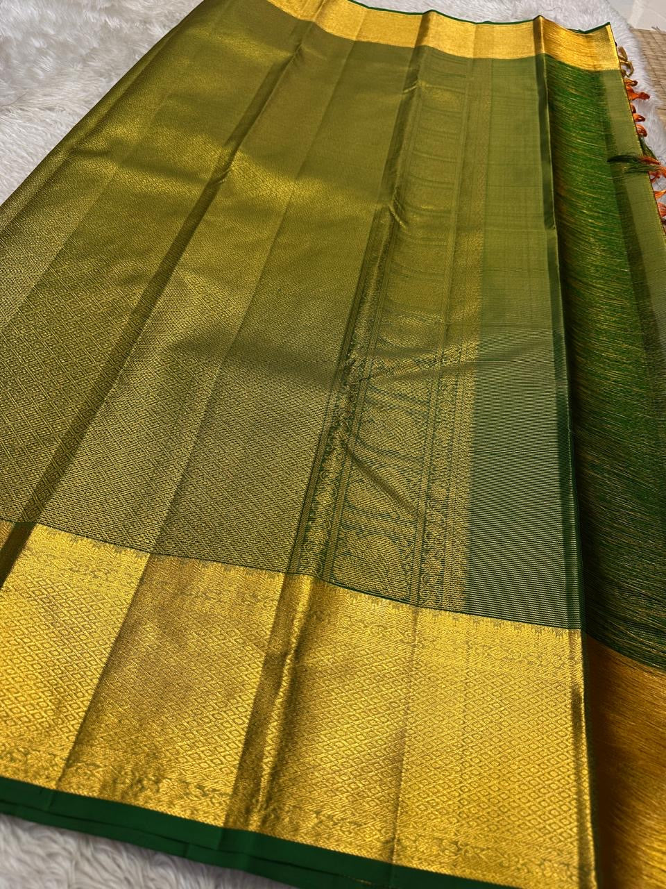 Kanchipuram silk saree mayil butta motifs across red silk body