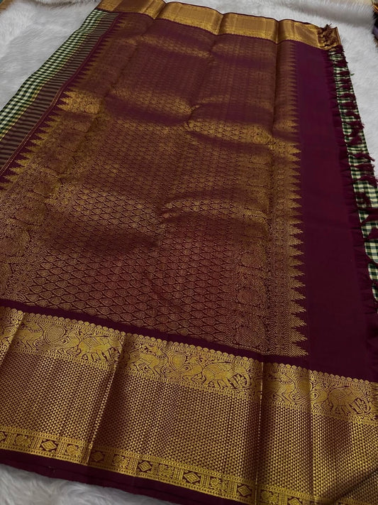 Kanjeevaram silk saree featuring green check pattern ivory grid and maroon peacock motif zari border detail