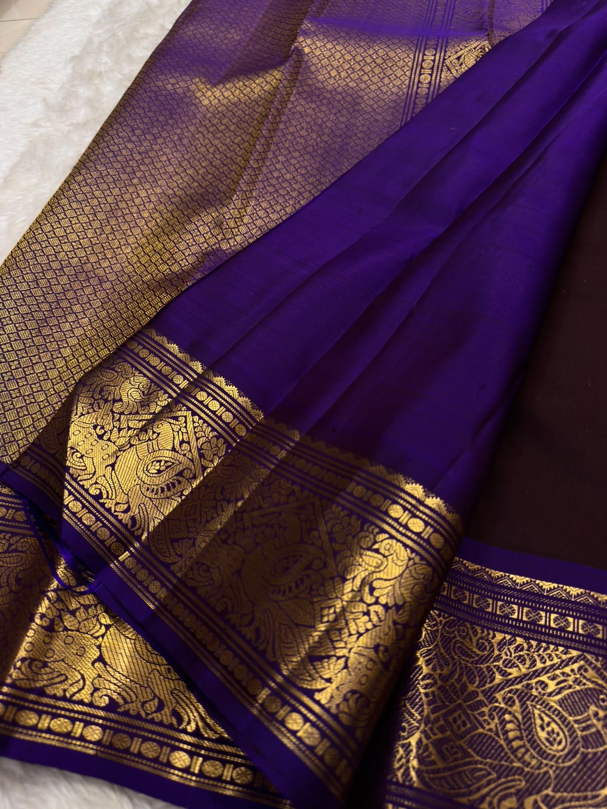 Deep aubergine Kanchipuram silk saree with gold Mayil and Kamalam buttas