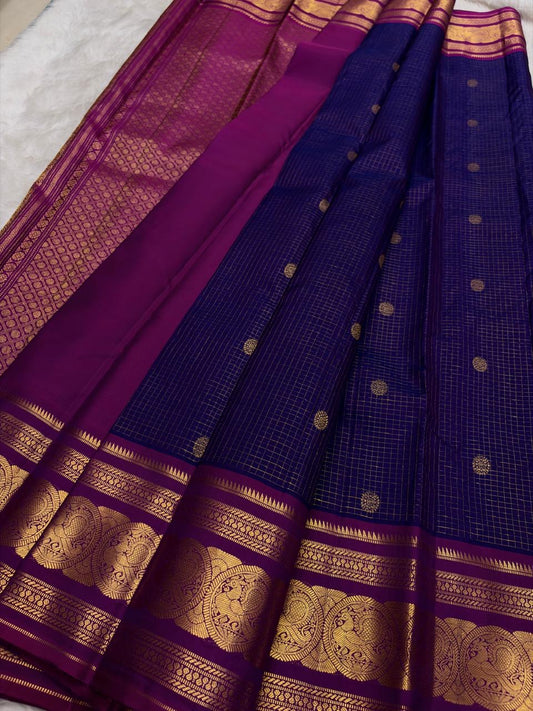 Green Kancheepuram silk saree featuring peacock motifs and zari kattam border with gold zari detail