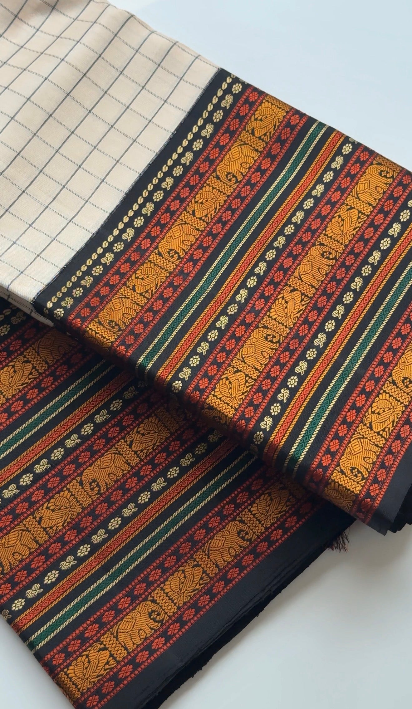 Kanjivaram silk saree ivory black with grid kattam weave and detailed silk thread motifs woven by hand