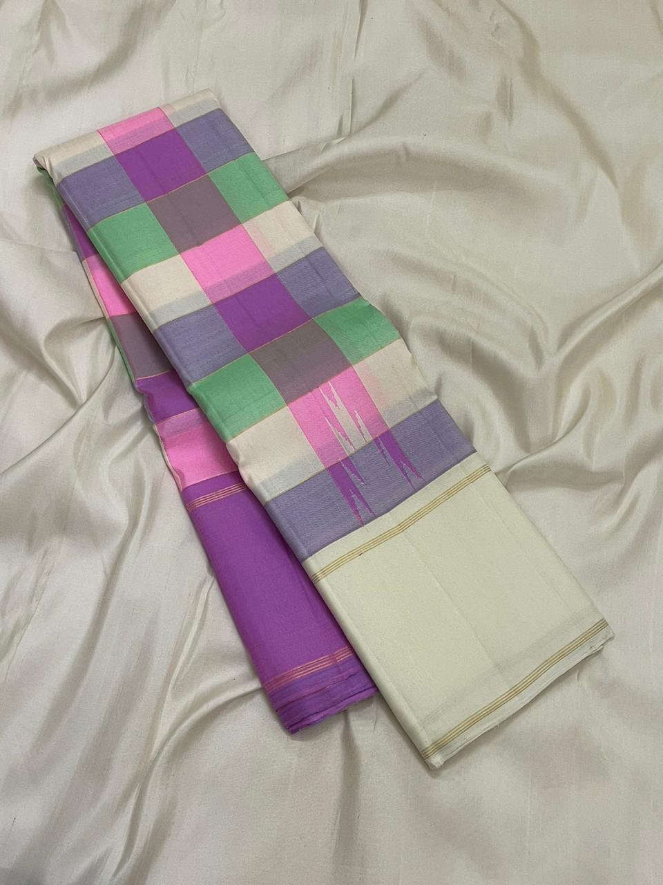 Ivory Kanjivaram silk saree with lilac pink Ganga Jamuna border folded view