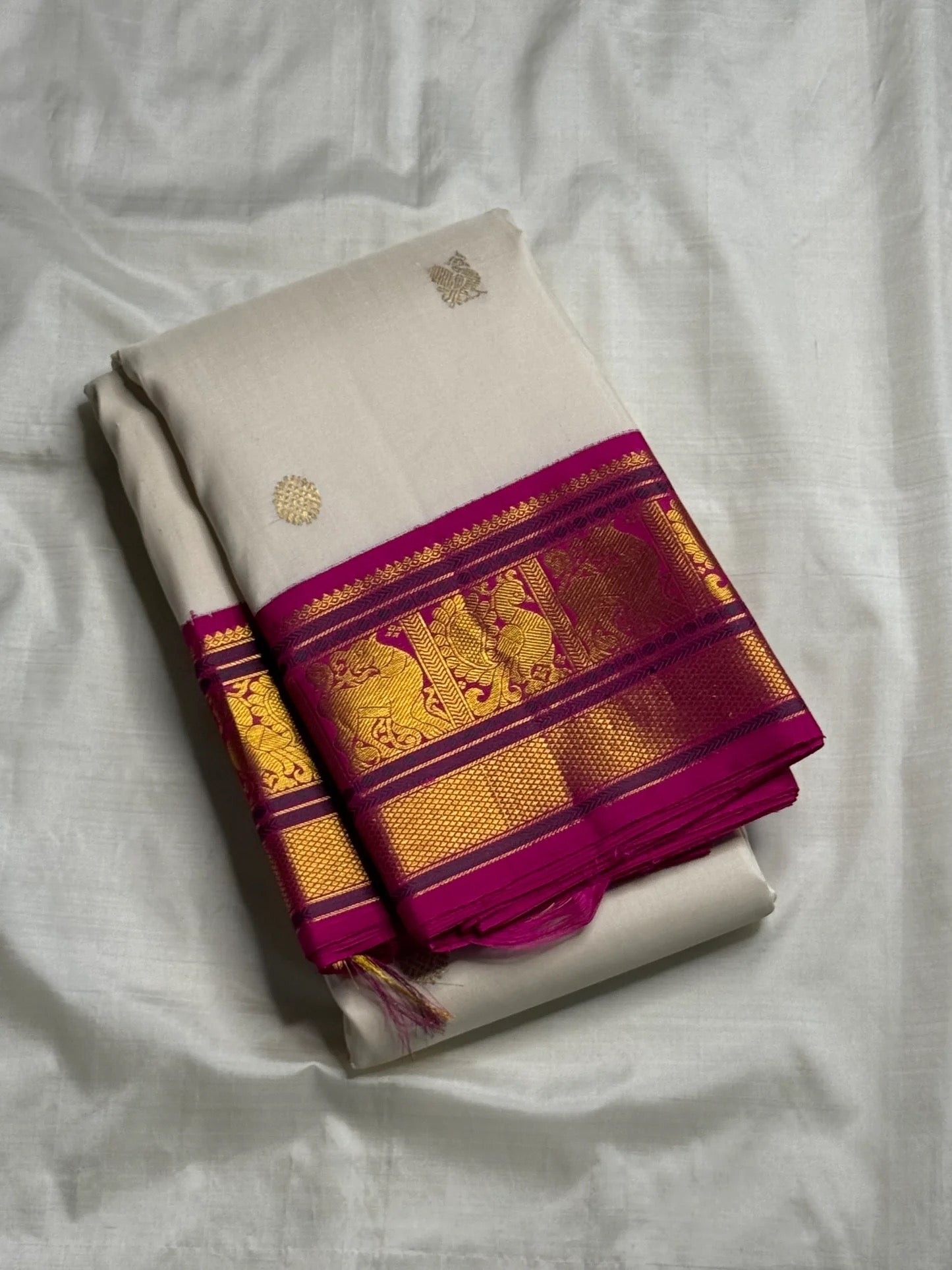ivory Kanchipuram silk saree with kv-myb weave folded view