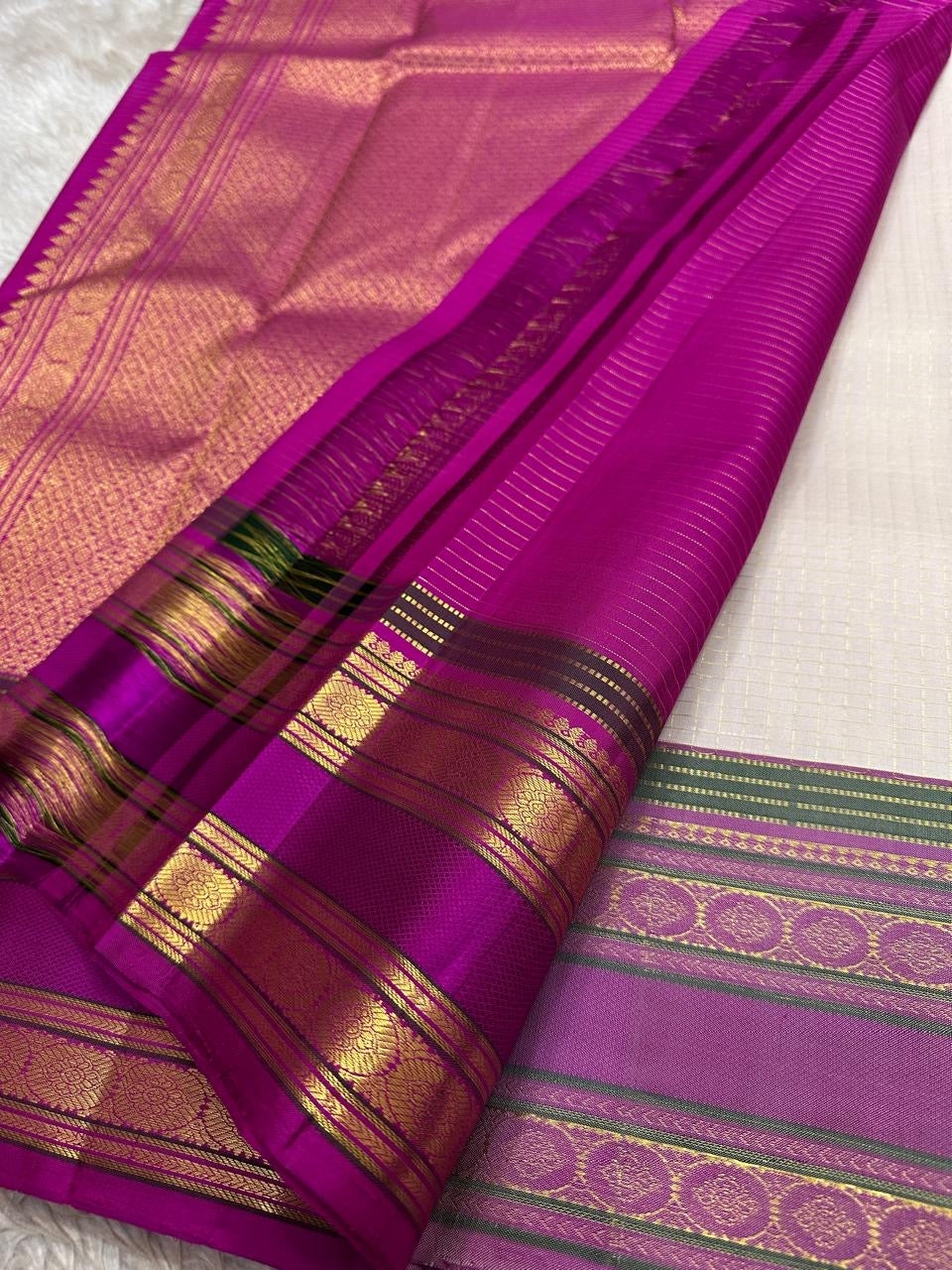 Close view of magenta zari woven border and pallu on pearl silver pure Kanchipuram silk saree