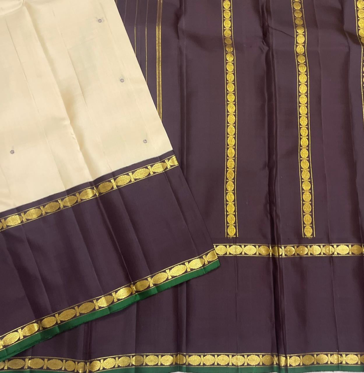 Kancheepuram silk saree white silk with gold zari motif detail close view