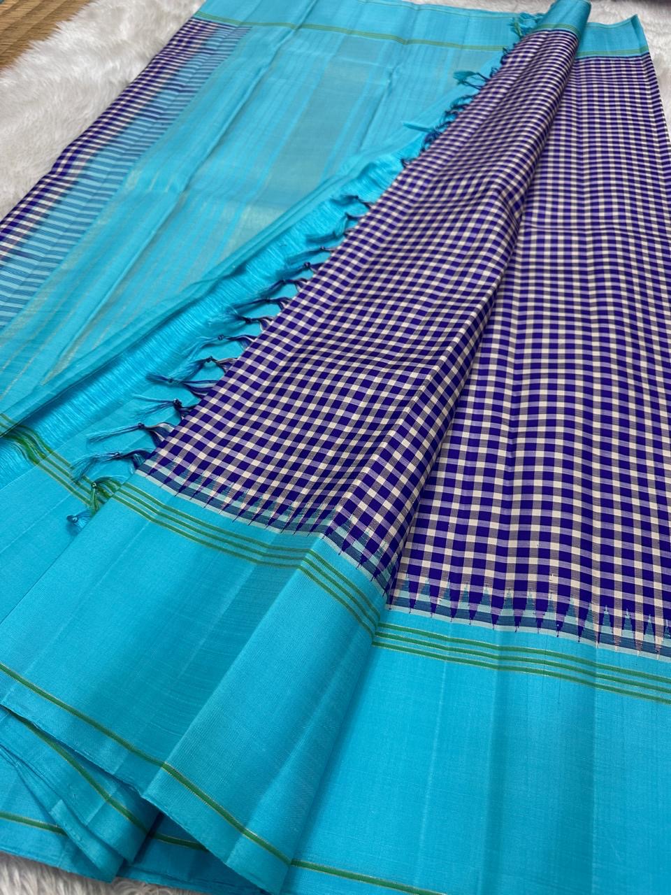 Kanjivaram silk saree aqua blue body with kanchi kattam indigo check pallu folded view