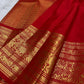 Kanchipattu silk saree in vibrant kumkum red with antique gold border Vanasringaram weave traditional zari detail