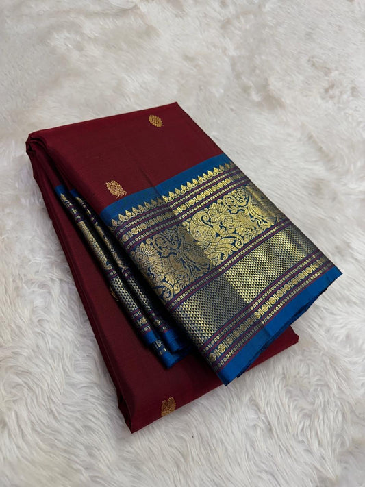 Red rust shot Kanchipuram silk saree with burgundy border folded view