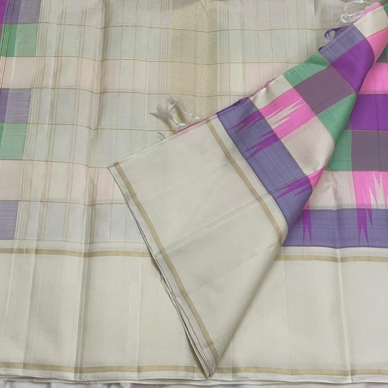 Kanjeevaram silk saree kanchi kattam grid with pastel tones closeup