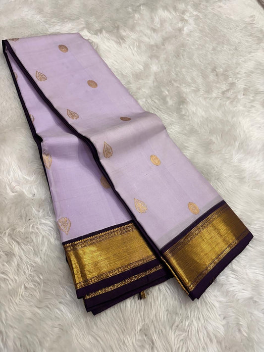 lilac purple kanchipuram silk saree with pavun butta and korvai border folded view