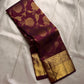Brown Kancheepuram silk saree featuring floral jaal pattern with gold zari detail