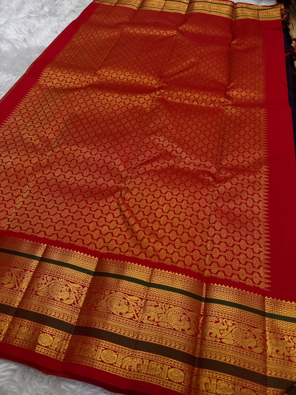 Kanjivaram silk saree temple gold zari border intricate design closeup