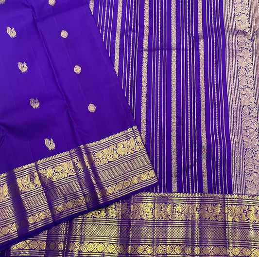 Pure Kanchipuram silk saree violet mayil butta folded view with traditional gold zari border Idam Living