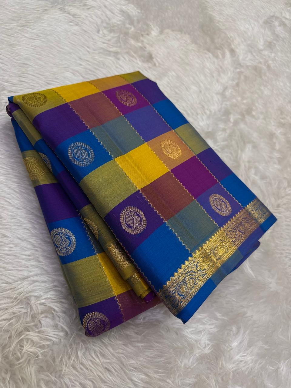 Multicolor Kanchipuram silk saree with Paalum Pazhamum checks in purple blue yellow folded view