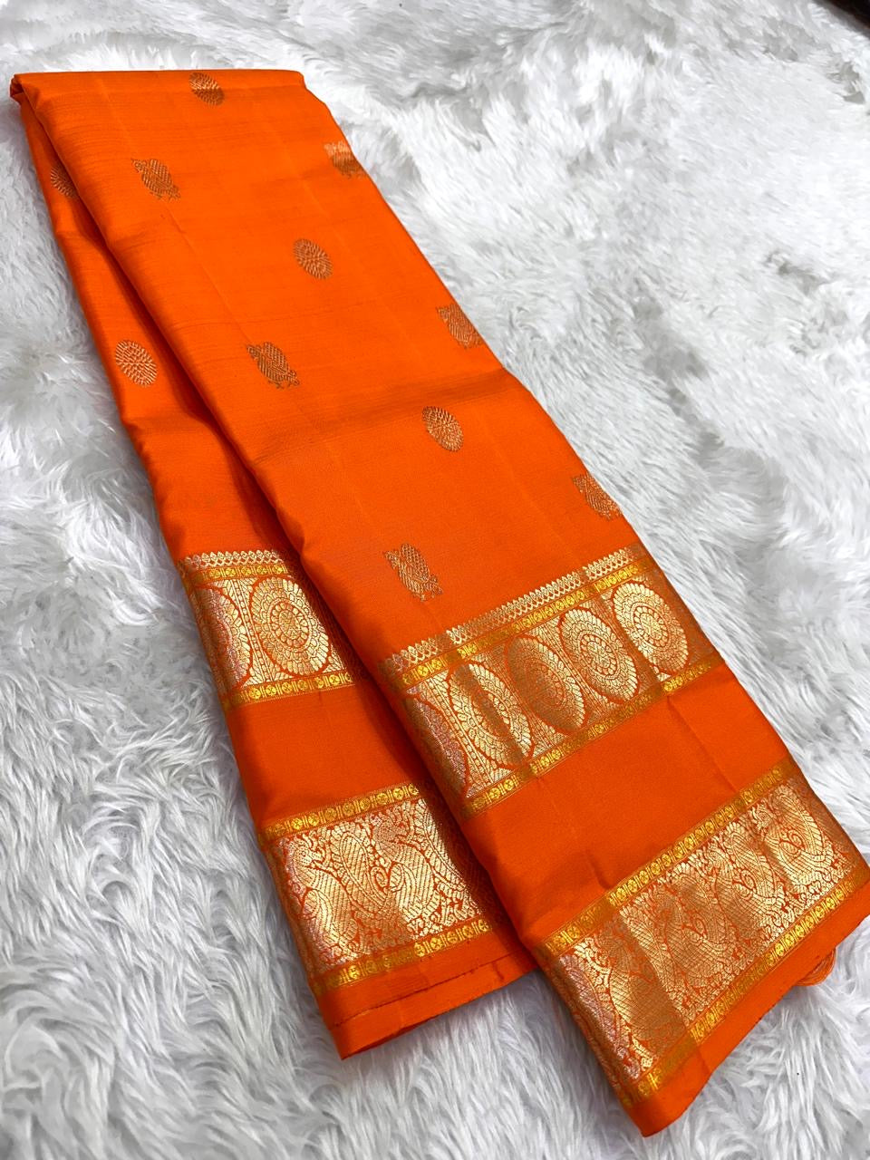 amber flame Kanchipuram silk saree with rt weave folded view
