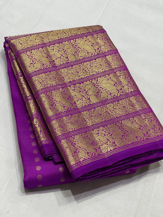 Orchid purple Kanchipuram silk saree folded view with gold varisaipet border and zari butta
