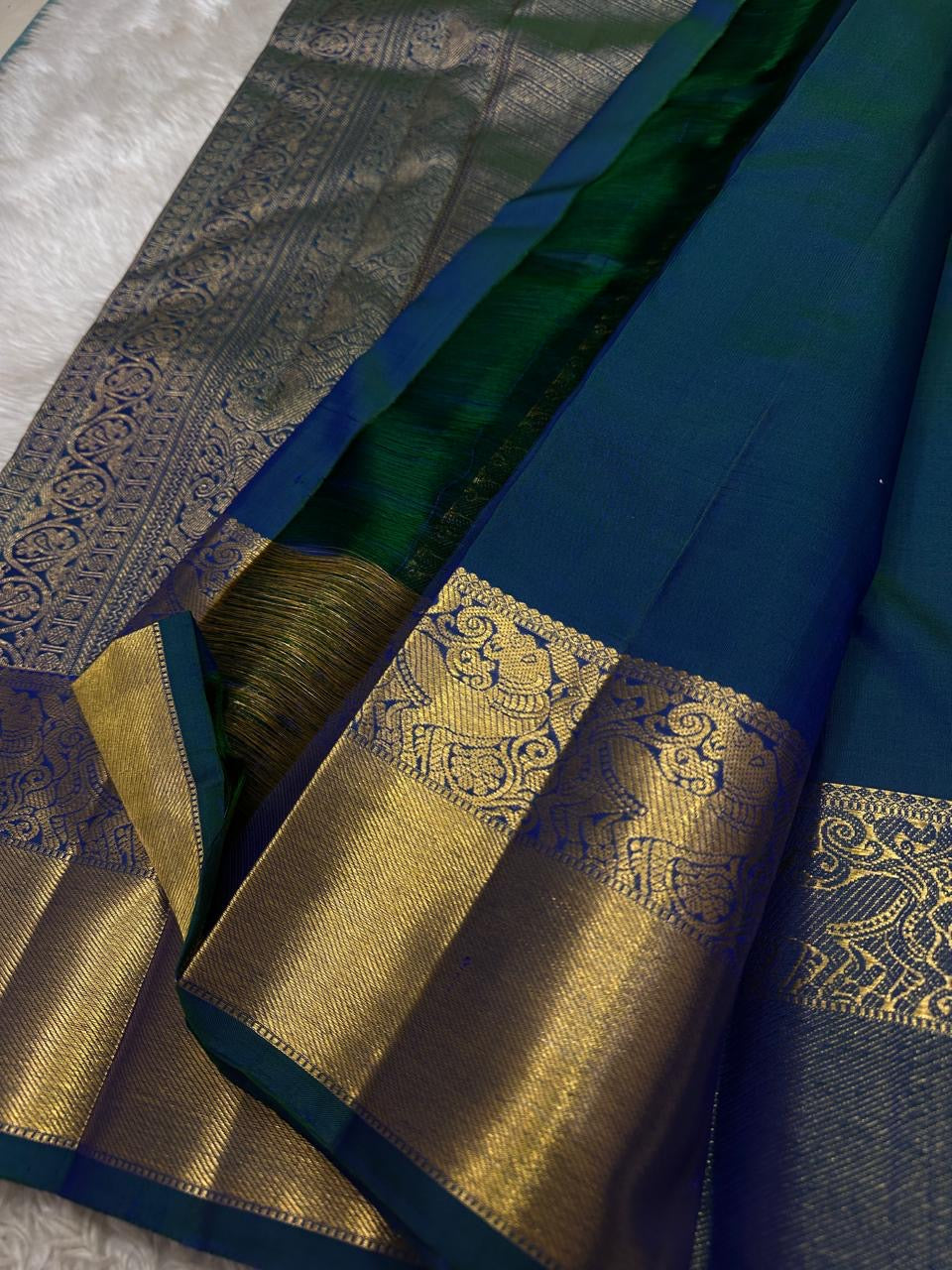 Blue Kanjeevaram silk saree with floral zari jaal pattern closeup detail