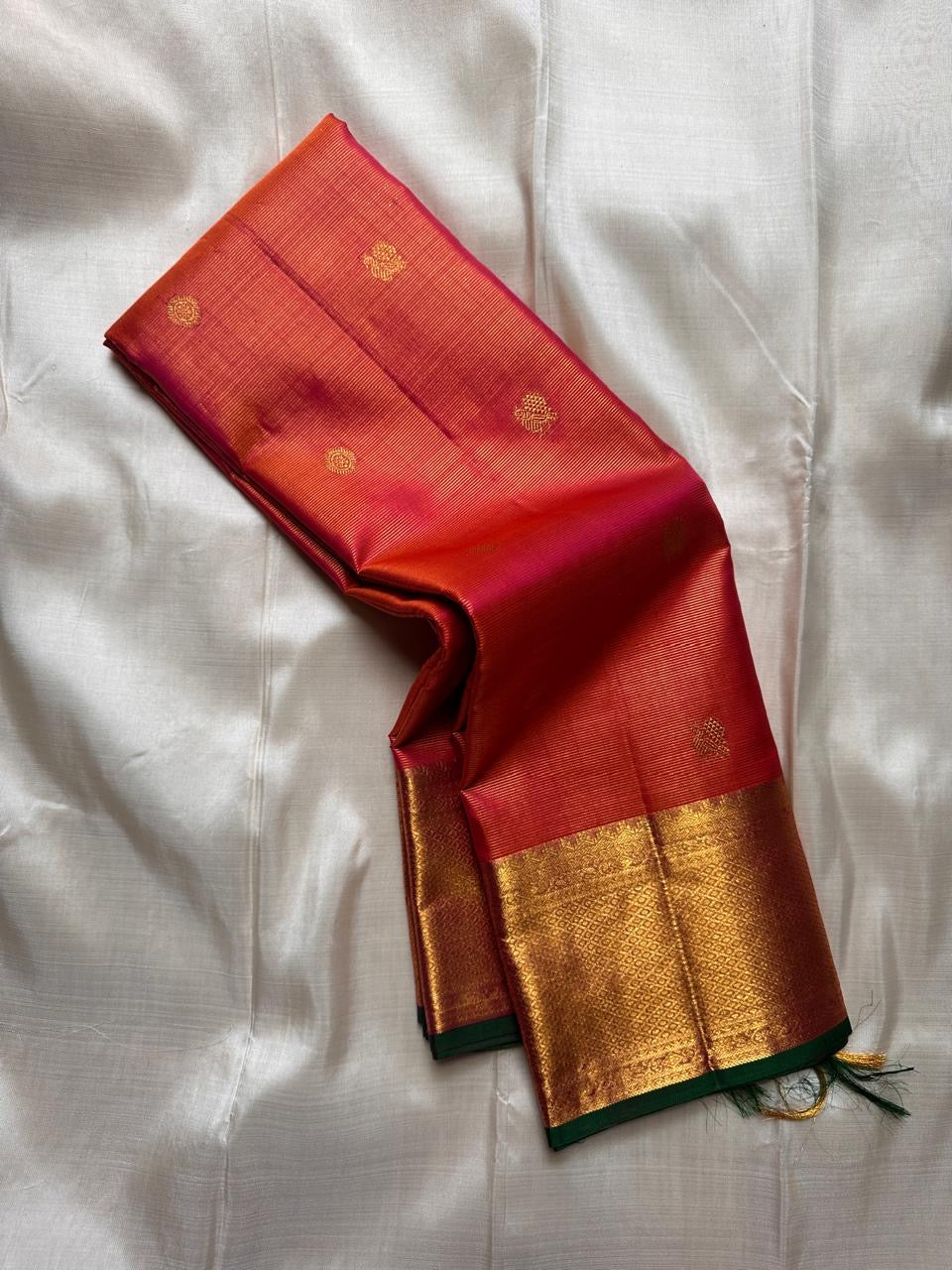 Kanjivaram silk saree orange red body with peacock butta detail