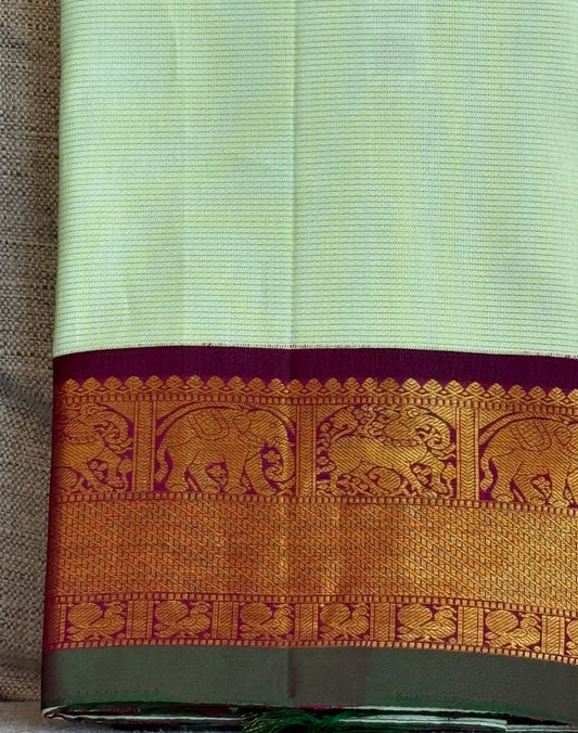 Pastel Kanchipuram silk saree folded view with vairaoosi zari lines and soft luminous weave