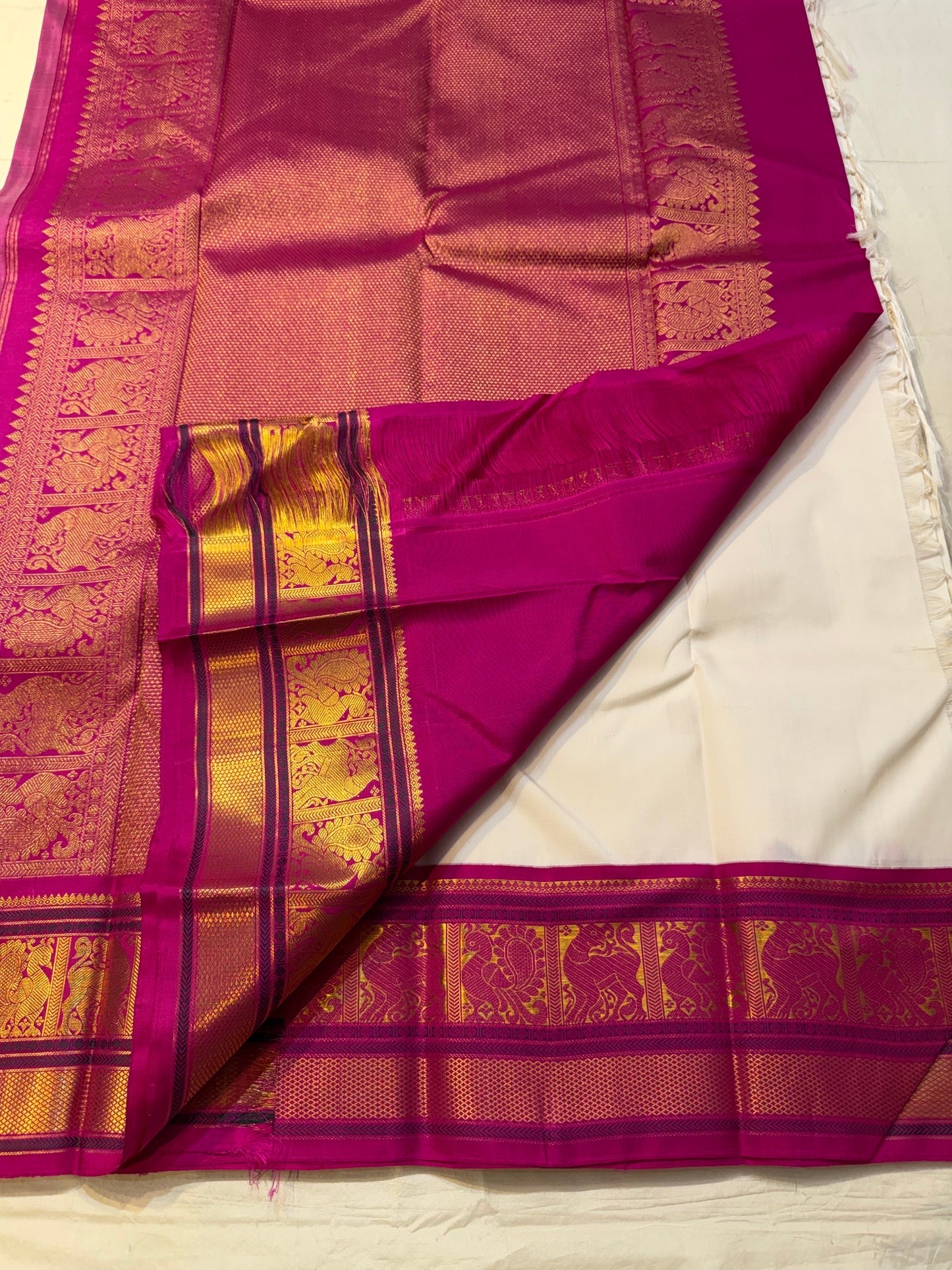 crimson border detail of ivory Kanchipuram silk saree
