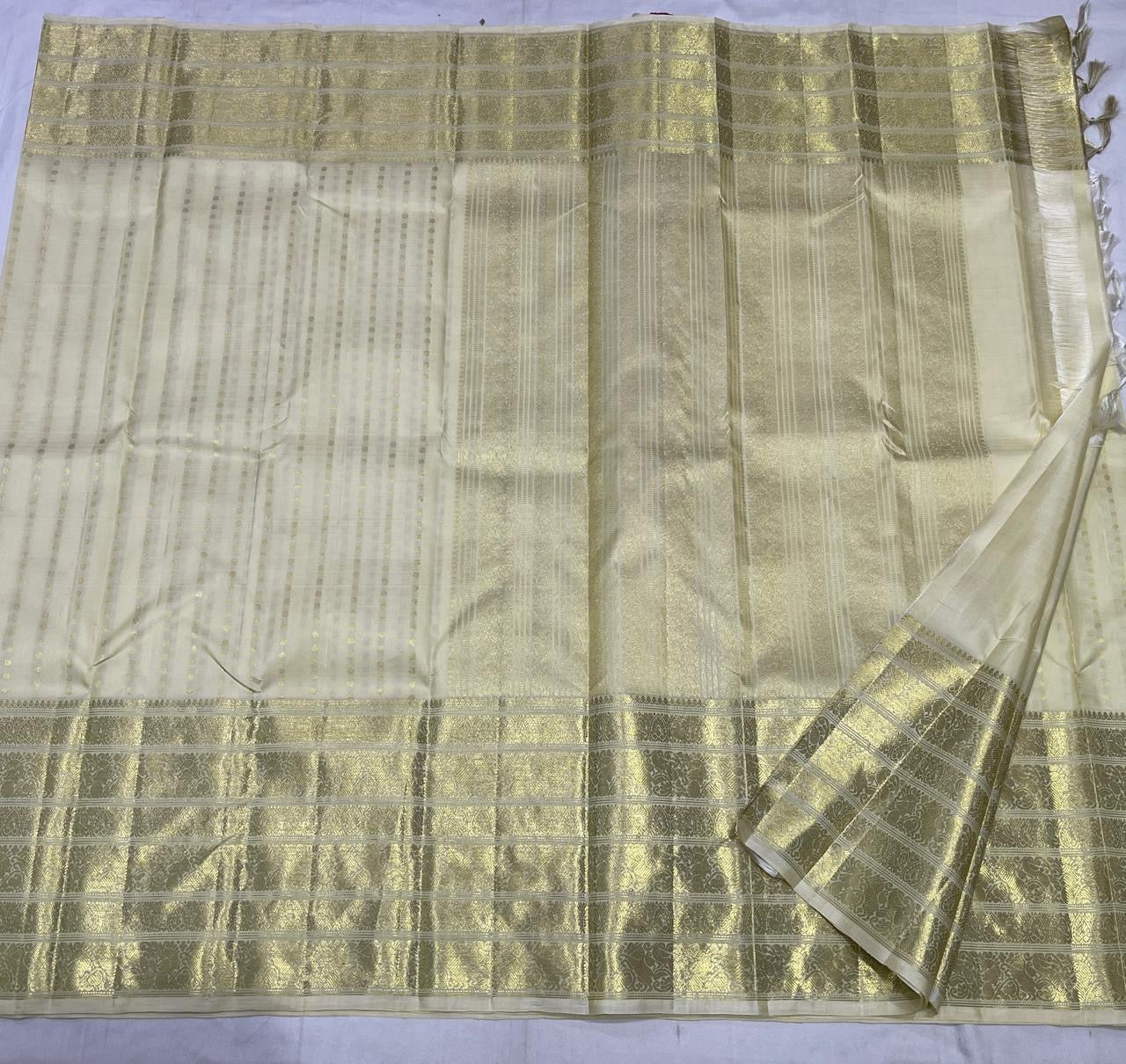 Kanjivaram silk saree pearl white with gold butta and border detailing