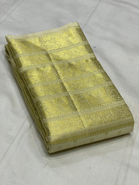 Kanjivaram silk saree pearl white body with gold zari border detail close up