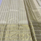 Kanjivaram silk saree ivory tone full view with traditional gold varisaipet border