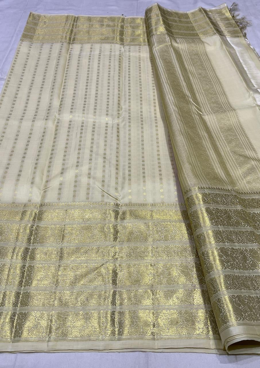 Kanjivaram silk saree ivory tone full view with traditional gold varisaipet border