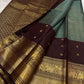 Kancheepuram silk saree brown panel with rich gold zari border close up