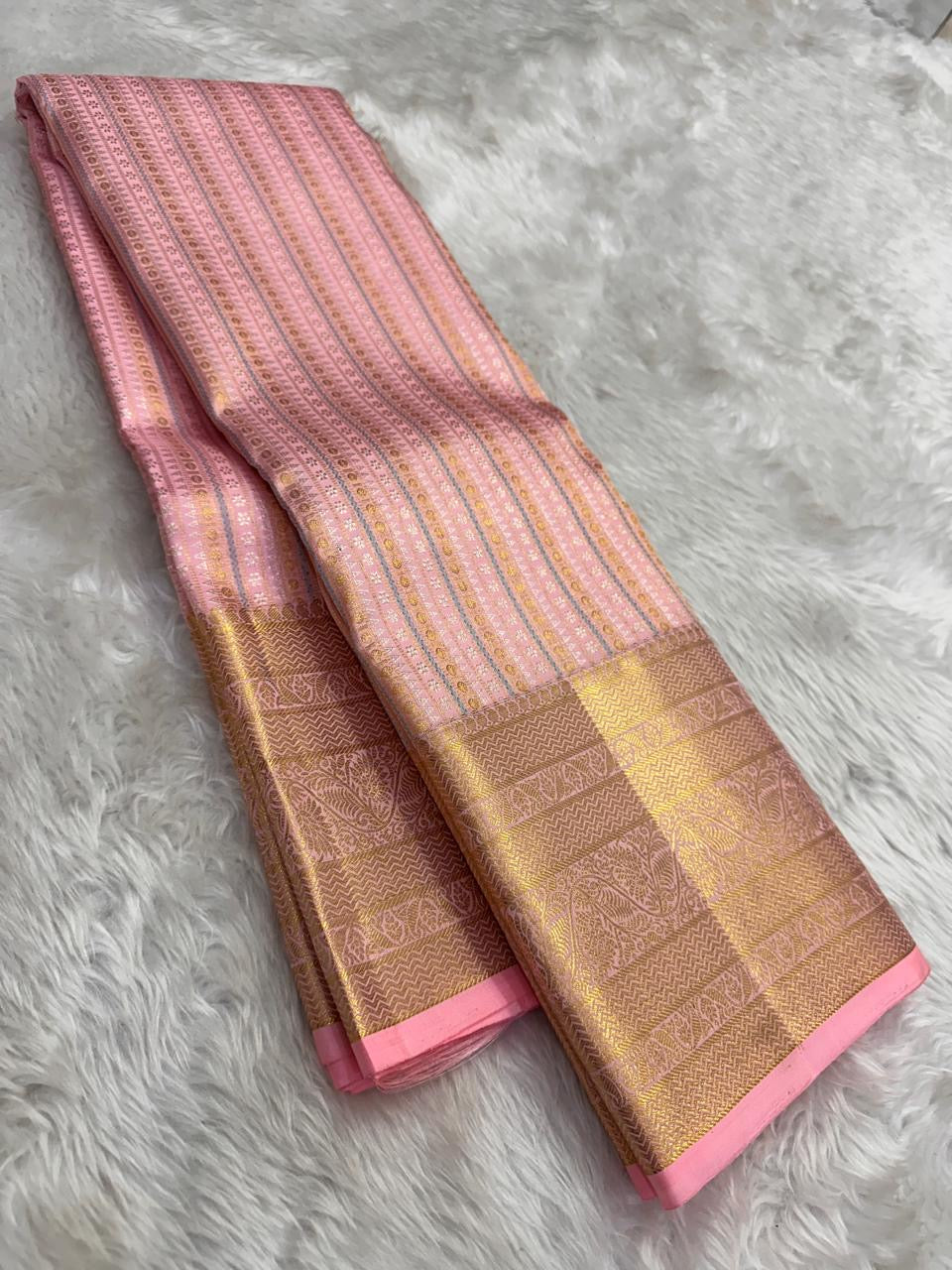Pink Kanjivaram saree with zari woven butta detail close up