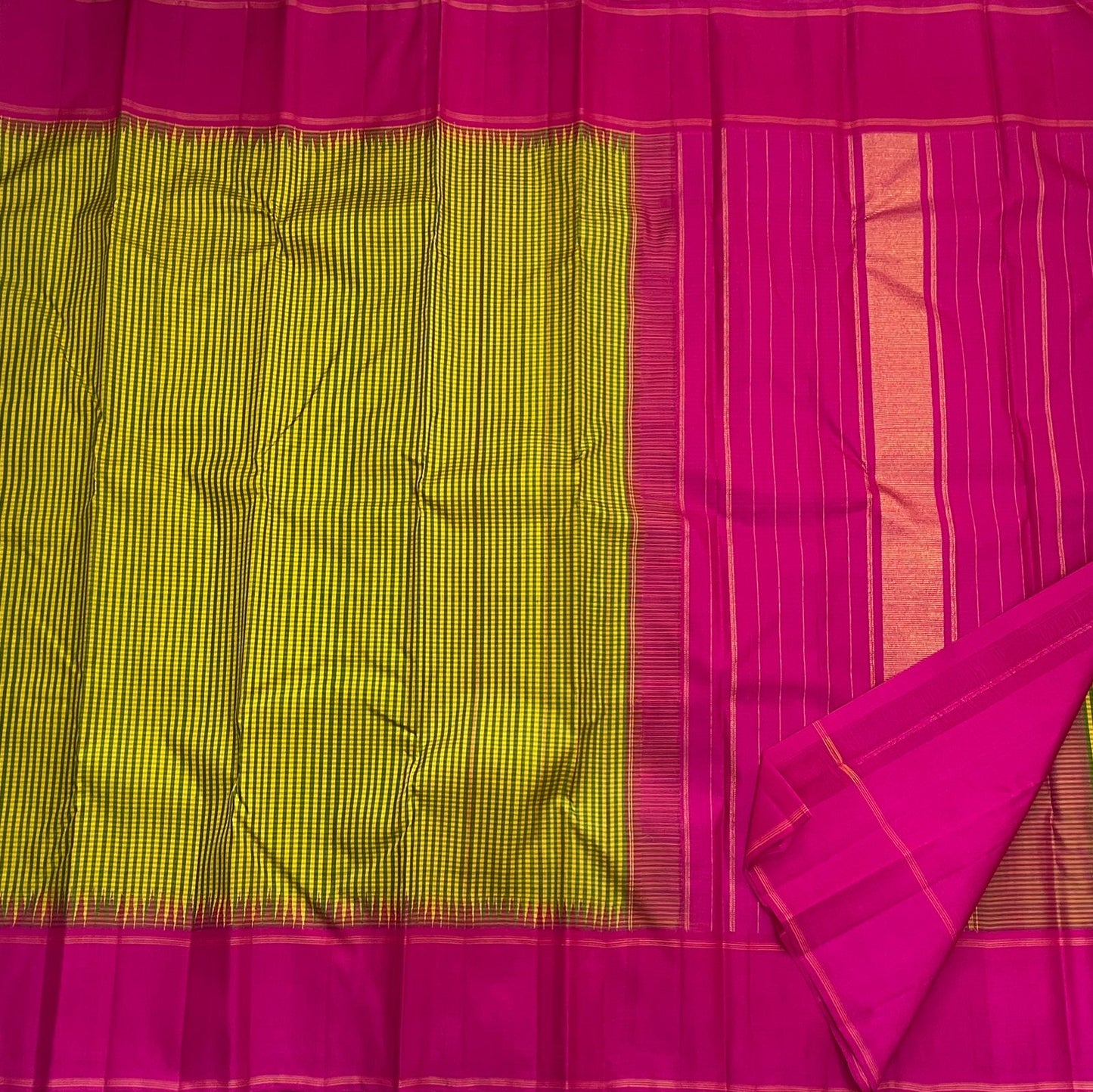 Magenta pallu with fine vertical lines and tassels beside green-yellow checked body (shipped from New Jersey USA)