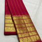 Red Kanjivaram silk saree draped view showing layered gold border and dotted zari motifs