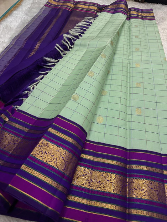 Kancheepuram silk saree green checkered body with gold zari and purple band detail