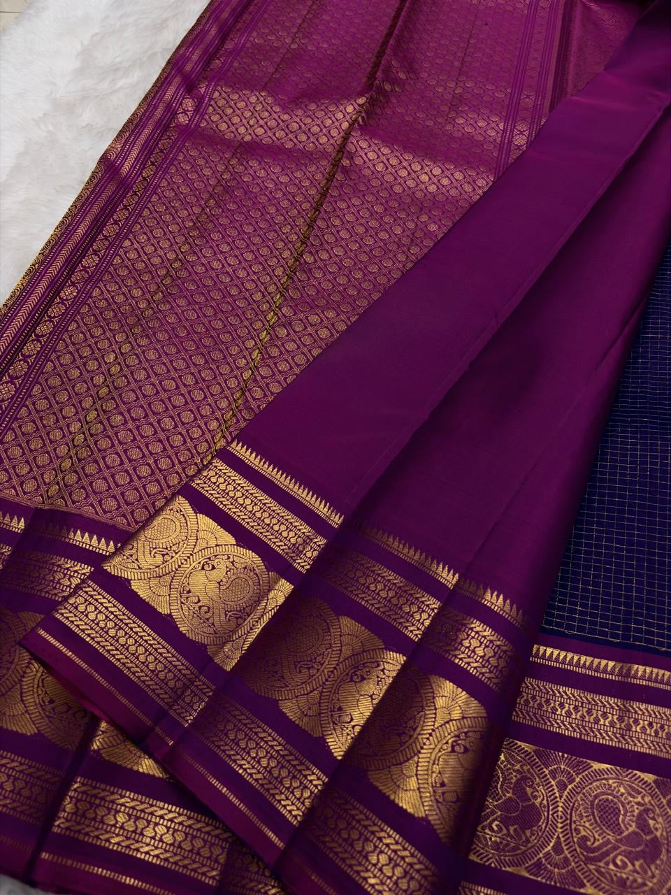 Green silk Kanchipuram saree with mayil motifs and zari kattam border pallu detail view